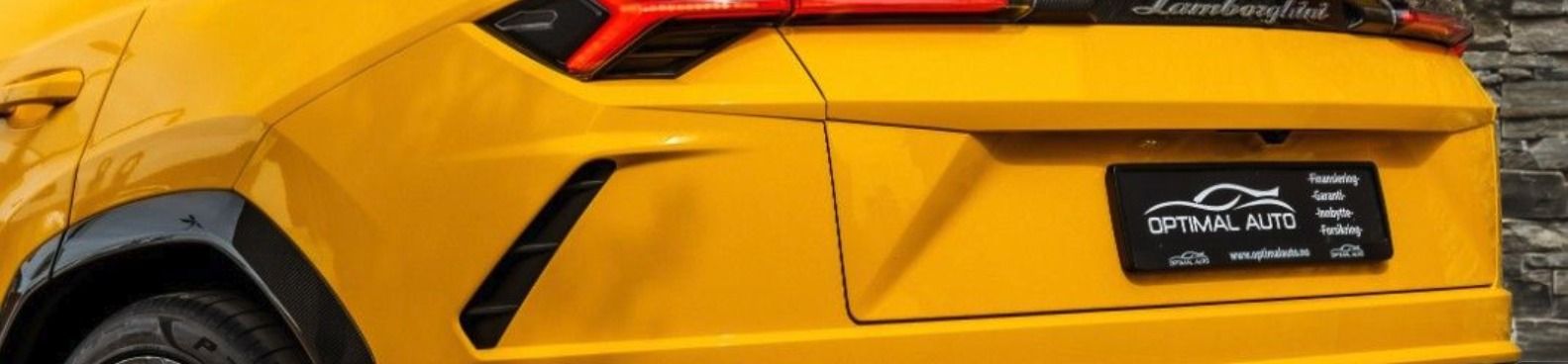 Gul Lamborghini Urus sett bakfra med Optimal Auto-skilt